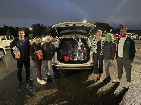 An image of students participating in a trunk or treat
